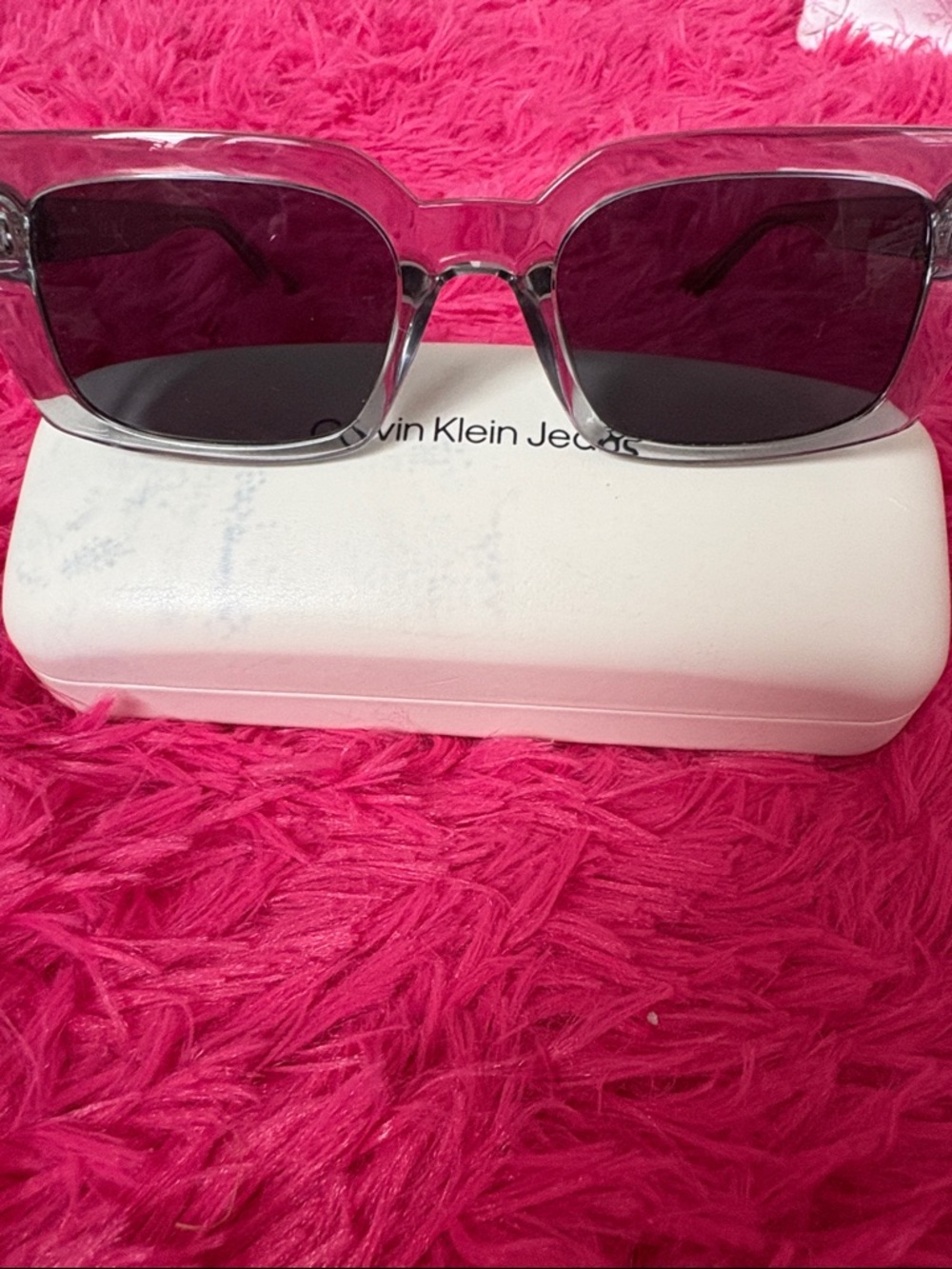 Calvin Klein Jeans Clear Frame Sunglasses with Dark Lenses